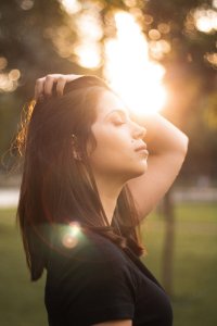 woman pushing back her hair