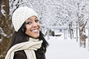 Portrait of a happy smiling woman in the snow