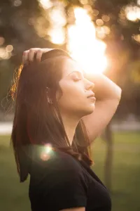 woman pushing back her hair